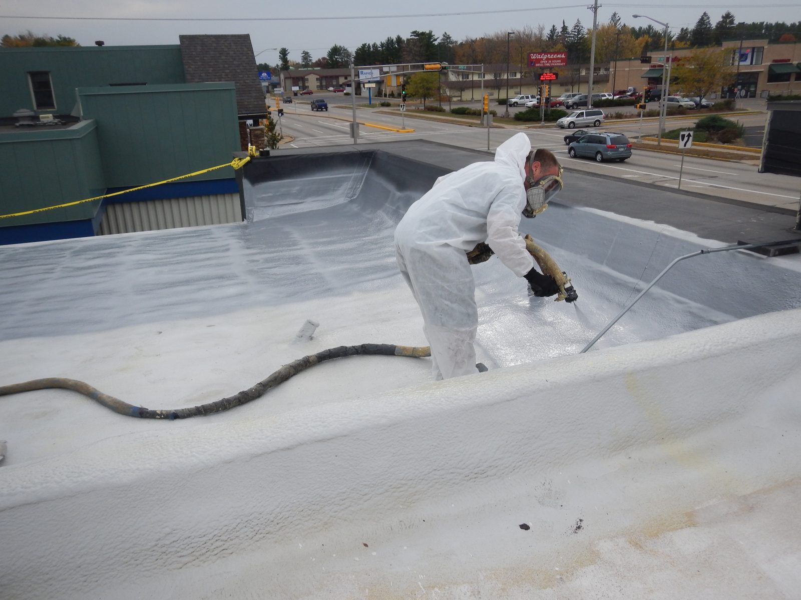 Metal porch roof sealed with sprayed polyurea membrane